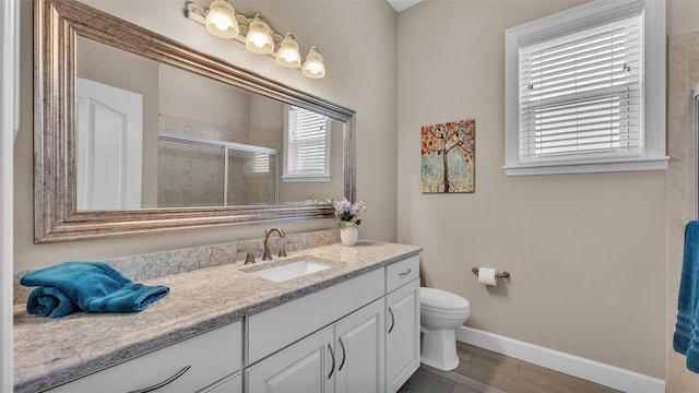 3121 Highlands By The Lake Way, Lakeland, FL 33812 - bathroom with vanity, a stall shower, and wood finished floors