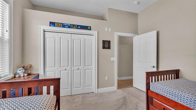 3121 Highlands By The Lake Way, Lakeland, FL 33812 - bedroom featuring carpet floors and a closet