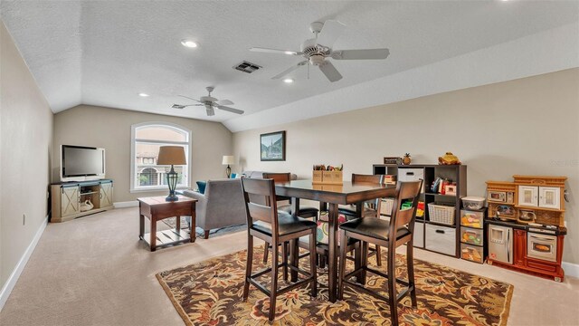 3121 Highlands By The Lake Way, Lakeland, FL 33812 - dining area with light colored carpet, vaulted ceiling, a ceiling fan, recessed lighting, and a textured ceiling