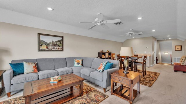 3121 Highlands By The Lake Way, Lakeland, FL 33812 - living room with vaulted ceiling, a ceiling fan, light colored carpet, recessed lighting, and a textured ceiling