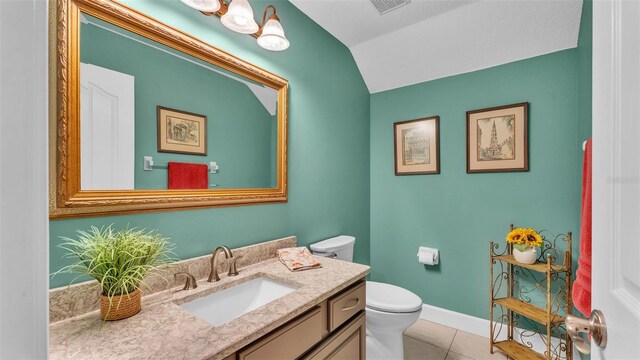 3121 Highlands By The Lake Way, Lakeland, FL 33812 - bathroom with vaulted ceiling, vanity, and tile patterned floors