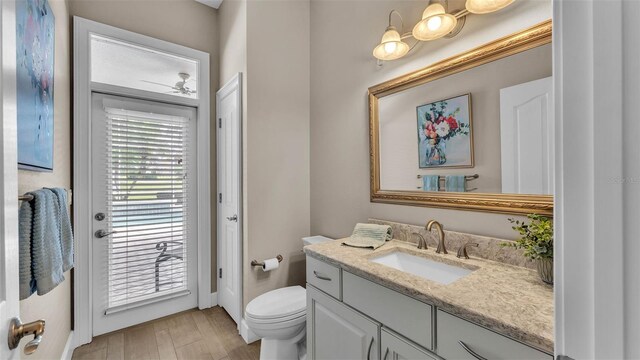 3121 Highlands By The Lake Way, Lakeland, FL 33812 - bathroom featuring vanity, a ceiling fan, and wood finished floors