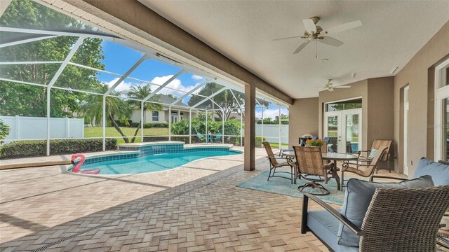 3121 Highlands By The Lake Way, Lakeland, FL 33812 - view of swimming pool featuring a ceiling fan, a patio, and a lanai