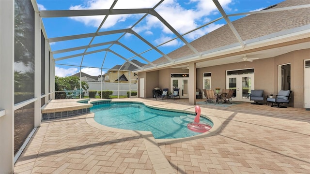 3121 Highlands By The Lake Way, Lakeland, FL 33812 - view of swimming pool with a patio area, a ceiling fan, french doors, a lanai, and outdoor dining space