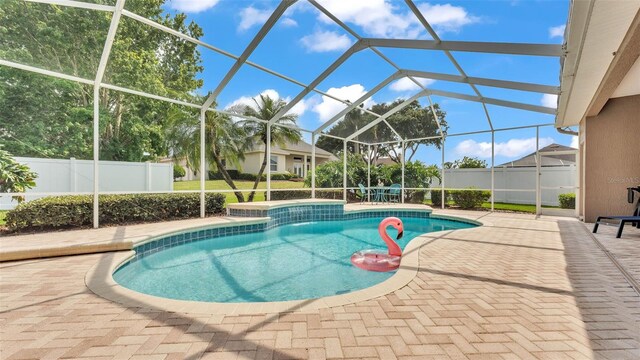 3121 Highlands By The Lake Way, Lakeland, FL 33812 - view of swimming pool with a patio area and glass enclosure