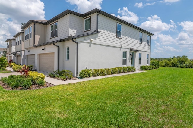 1754 Sanibel Dr, Davenport, FL 33896 - view of side of home with a garage, a yard, driveway, and stucco siding