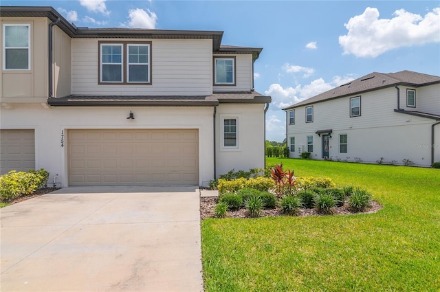 1754 Sanibel Dr, Davenport, FL 33896 - view of front facade with a garage, a front lawn, concrete driveway, and stucco siding