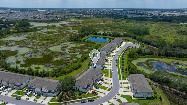 1754 Sanibel Dr, Davenport, FL 33896 - aerial overview of property's location featuring a nearby body of water and nearby suburban area