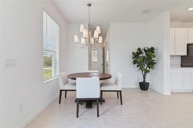 1754 Sanibel Dr, Davenport, FL 33896 - dining space with a chandelier, light tile patterned floors, and baseboards