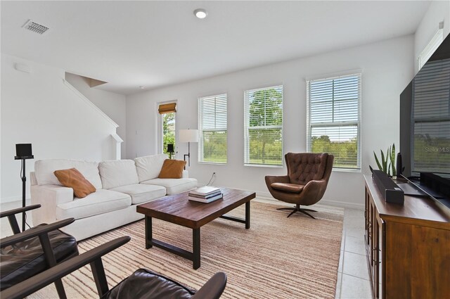 1754 Sanibel Dr, Davenport, FL 33896 - living room featuring light tile patterned floors and baseboards