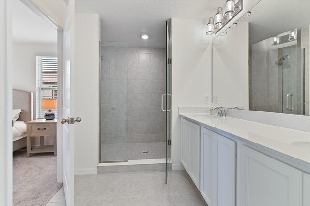 1754 Sanibel Dr, Davenport, FL 33896 - bathroom with ensuite bathroom, double vanity, baseboards, a shower stall, and recessed lighting