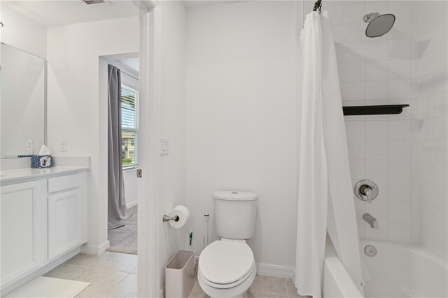 1754 Sanibel Dr, Davenport, FL 33896 - bathroom featuring vanity, toilet, shower / bathtub combination with curtain, baseboards, and tile patterned floors