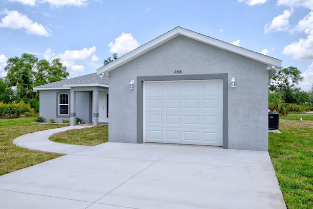 2438 W Wellston Rd, Avon Park, FL 33825 - single story home with stucco siding, a front lawn, concrete driveway, and central AC