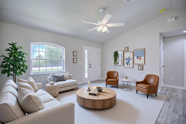2438 W Wellston Rd, Avon Park, FL 33825 - living area with light wood-style floors, lofted ceiling, a ceiling fan, and baseboards