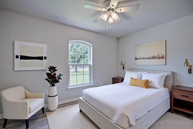 2438 W Wellston Rd, Avon Park, FL 33825 - bedroom with wood finished floors, baseboards, and a ceiling fan