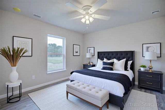2438 W Wellston Rd, Avon Park, FL 33825 - bedroom with wood finished floors, baseboards, and ceiling fan