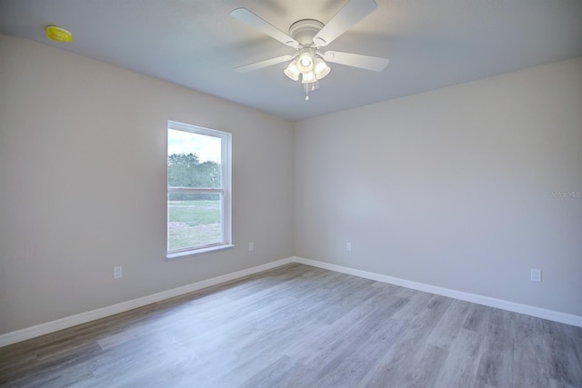 2438 W Wellston Rd, Avon Park, FL 33825 - spare room featuring wood finished floors, baseboards, and ceiling fan