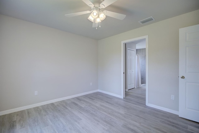 2438 W Wellston Rd, Avon Park, FL 33825 - unfurnished room featuring wood finished floors, baseboards, and ceiling fan