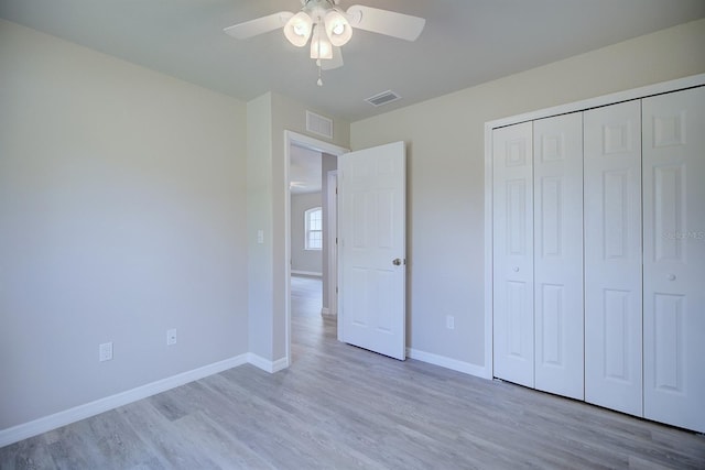 2438 W Wellston Rd, Avon Park, FL 33825 - unfurnished bedroom featuring wood finished floors, baseboards, a closet, and ceiling fan