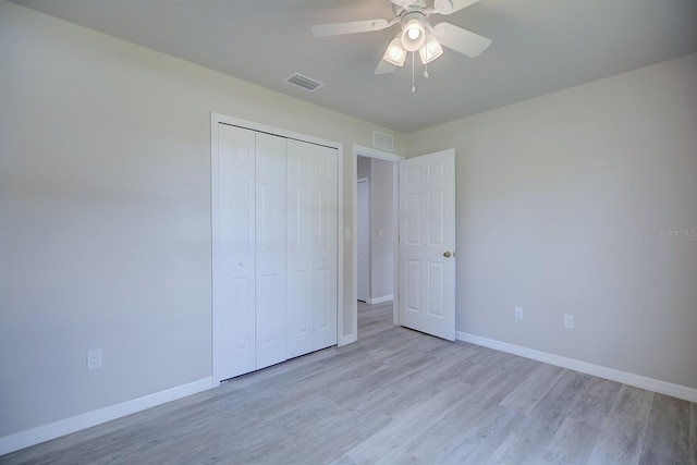 2438 W Wellston Rd, Avon Park, FL 33825 - unfurnished bedroom featuring light wood-style flooring, baseboards, a closet, and ceiling fan