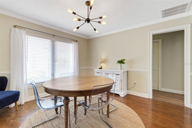 6819 Broken Arrow Trl S, Lakeland, FL 33813 - dining space with a chandelier, healthy amount of natural light, wood finished floors, ornamental molding, and a textured ceiling