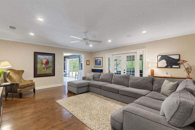 6819 Broken Arrow Trl S, Lakeland, FL 33813 - living room featuring french doors, crown molding, dark wood-style flooring, recessed lighting, and a ceiling fan