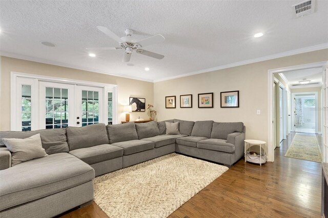 6819 Broken Arrow Trl S, Lakeland, FL 33813 - living area featuring french doors, dark wood-style floors, a ceiling fan, crown molding, and recessed lighting