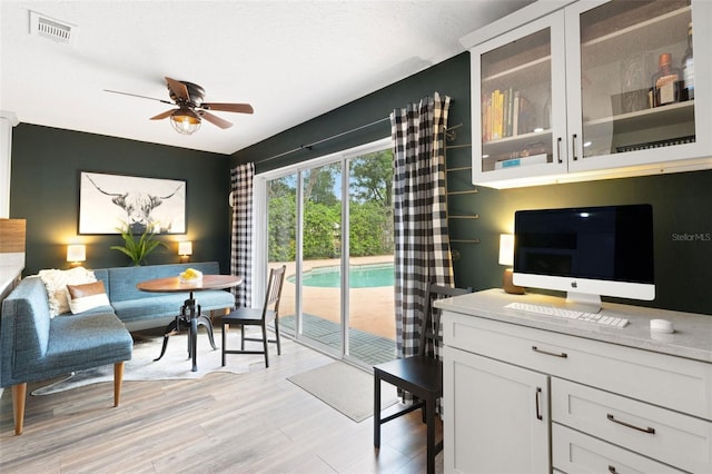 6819 Broken Arrow Trl S, Lakeland, FL 33813 - living area with ceiling fan and light wood finished floors
