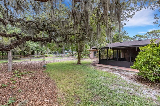 6819 Broken Arrow Trl S, Lakeland, FL 33813 - view of yard with a sunroom