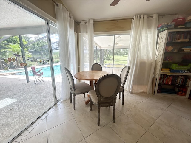 1909 Masters Way, Plant City, FL 33566 - dining space featuring a ceiling fan, a sunroom, light tile patterned floors, and healthy amount of natural light