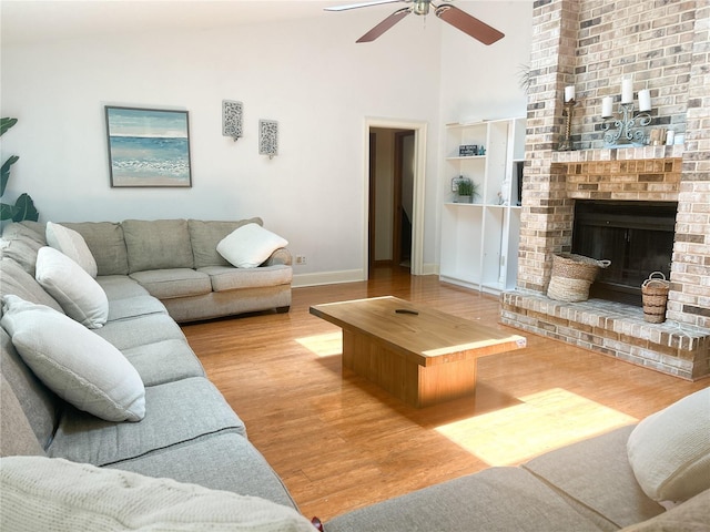 1909 Masters Way, Plant City, FL 33566 - living area with ceiling fan, built in features, high vaulted ceiling, wood finished floors, and a fireplace