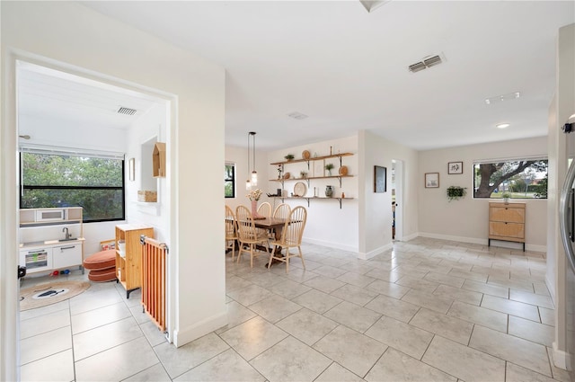 818 Woodward St, Lakeland, FL 33803 - hall with light tile patterned floors and baseboards
