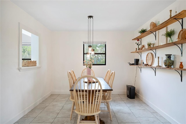 818 Woodward St, Lakeland, FL 33803 - dining space featuring baseboards and light tile patterned floors