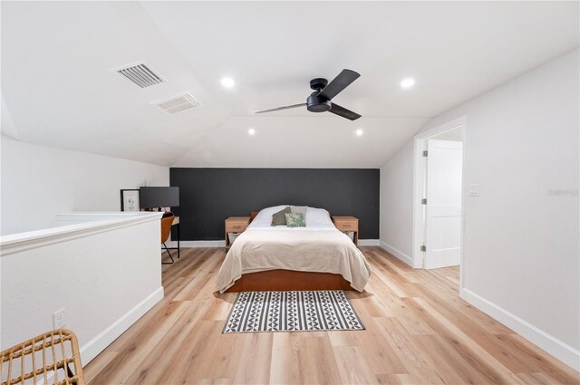 818 Woodward St, Lakeland, FL 33803 - bedroom with light wood finished floors, vaulted ceiling, baseboards, and ceiling fan