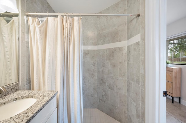 818 Woodward St, Lakeland, FL 33803 - full bathroom featuring vanity, a tile shower, and tile patterned flooring