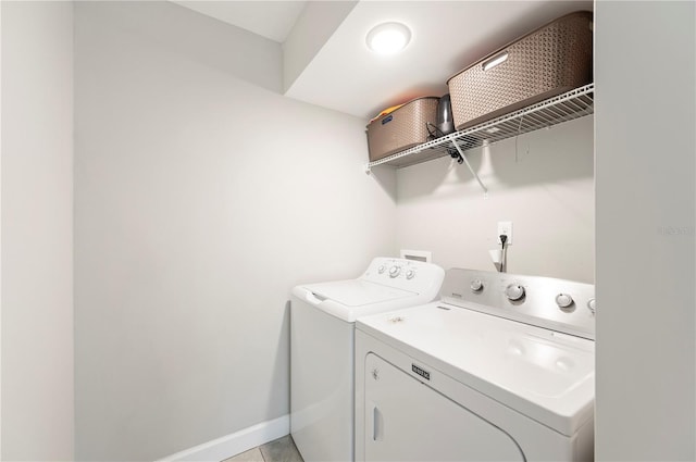 818 Woodward St, Lakeland, FL 33803 - laundry room featuring washer and dryer and baseboards