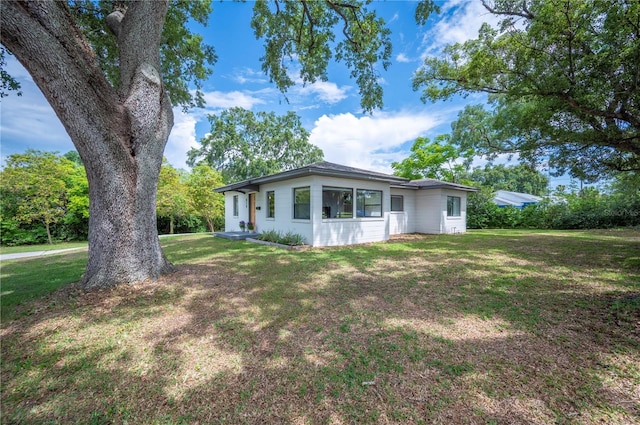 818 Woodward St, Lakeland, FL 33803 - view of front of property with a front yard