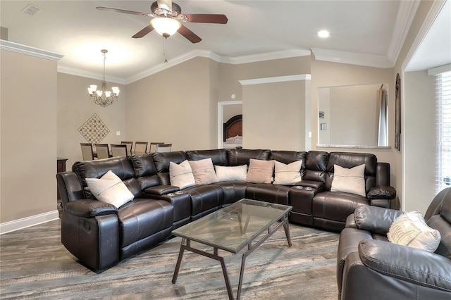 1300 Ariana Woods Cir, Auburndale, FL 33823 - living room featuring ceiling fan, wood finished floors, a chandelier, ornamental molding, and vaulted ceiling