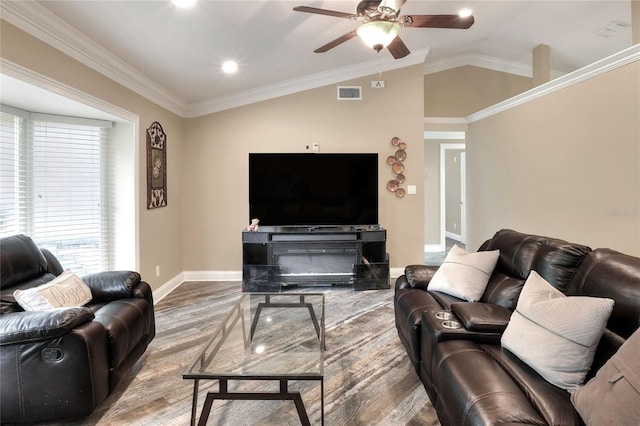 1300 Ariana Woods Cir, Auburndale, FL 33823 - living room with wood finished floors, ceiling fan, vaulted ceiling, crown molding, and recessed lighting