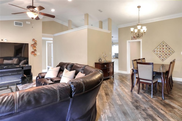 1300 Ariana Woods Cir, Auburndale, FL 33823 - living room featuring a chandelier, ceiling fan, dark wood-style flooring, lofted ceiling, and ornamental molding