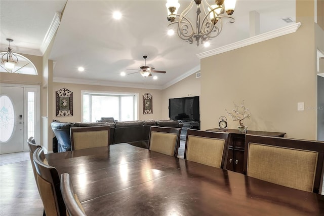 1300 Ariana Woods Cir, Auburndale, FL 33823 - dining area featuring crown molding, ceiling fan, a chandelier, and wood finished floors