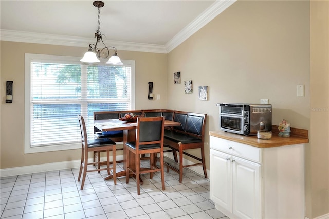 1300 Ariana Woods Cir, Auburndale, FL 33823 - dining area with ornamental molding and light tile patterned floors