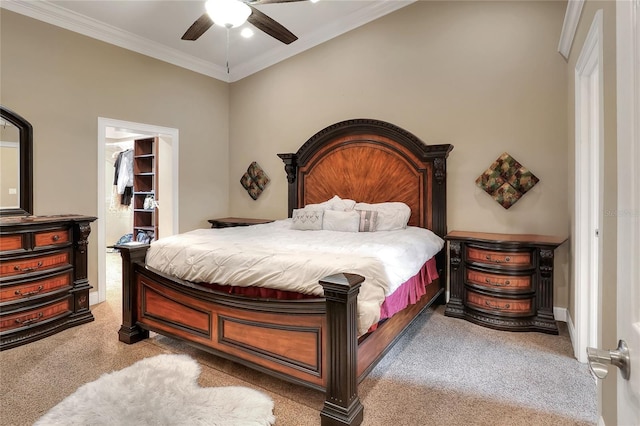1300 Ariana Woods Cir, Auburndale, FL 33823 - carpeted bedroom with a walk in closet, ornamental molding, a closet, and ceiling fan