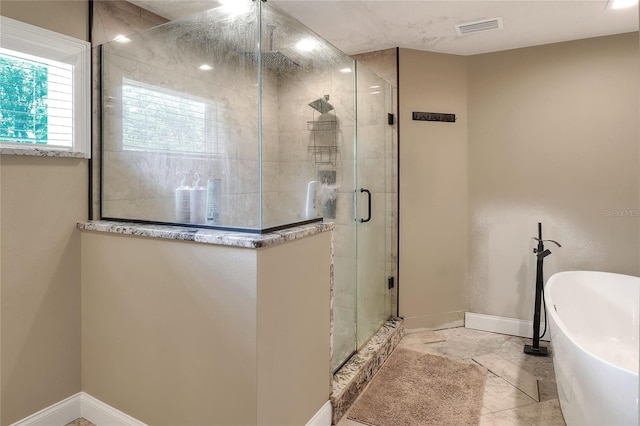 1300 Ariana Woods Cir, Auburndale, FL 33823 - full bath with a soaking tub and a shower stall