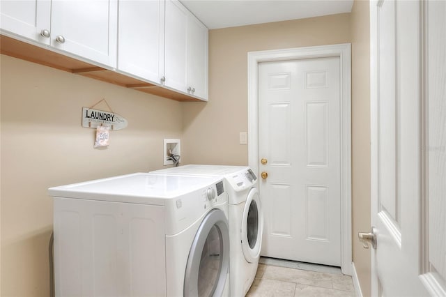 1300 Ariana Woods Cir, Auburndale, FL 33823 - washroom featuring cabinet space, washer and dryer, and light tile patterned floors