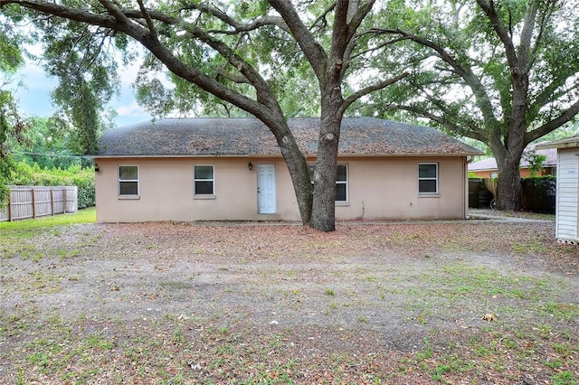 1300 Ariana Woods Cir, Auburndale, FL 33823 - back of house with stucco siding