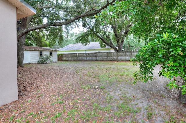 1300 Ariana Woods Cir, Auburndale, FL 33823 - view of yard with an outdoor structure