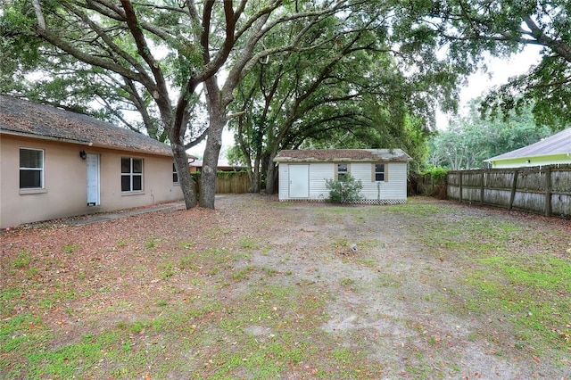 1300 Ariana Woods Cir, Auburndale, FL 33823 - fenced backyard featuring an outdoor structure