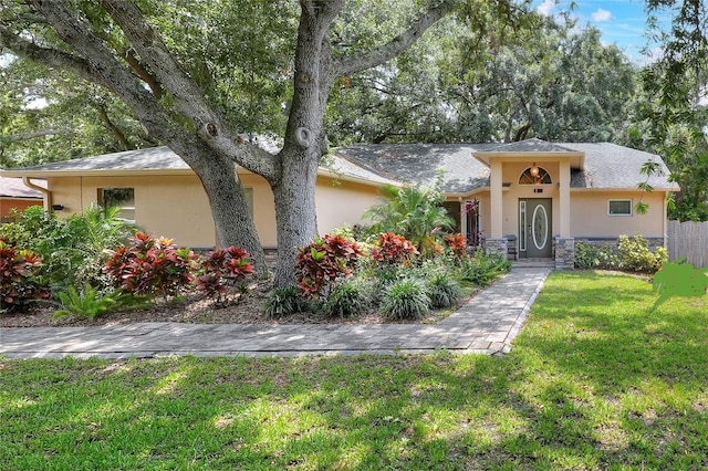 1300 Ariana Woods Cir, Auburndale, FL 33823 - view of front of property featuring stucco siding and stone siding