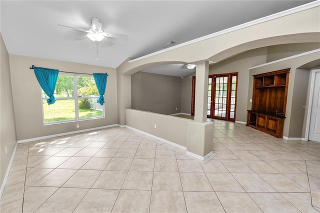 16804 Hawkridge Rd, Lithia, FL 33547 - unfurnished room with ceiling fan, light tile patterned floors, arched walkways, baseboards, and vaulted ceiling